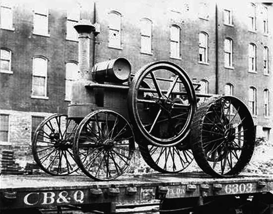 A Charter traction engine staged for rail transport.